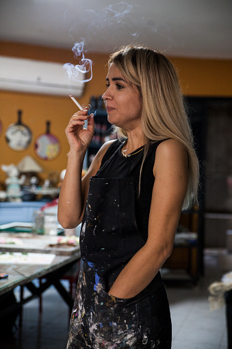 Young Artist Woman Smoking With Dirty Apron