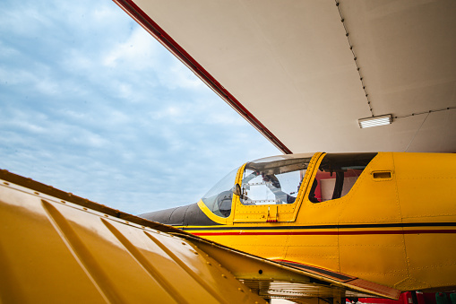 Pilot preparing an ultralight plane for a flight