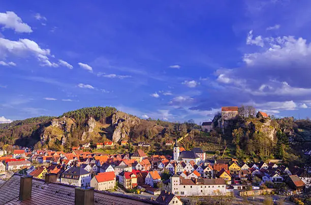 Elevated view on the Franconian town of Pottenstein located in the district Bayreuth, Upper Franconia/Bavaria, Germany on a late spring afternoon.