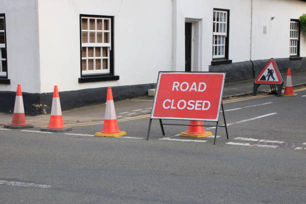 istock Road Closed Red sign with traffic cones UK 1732224081