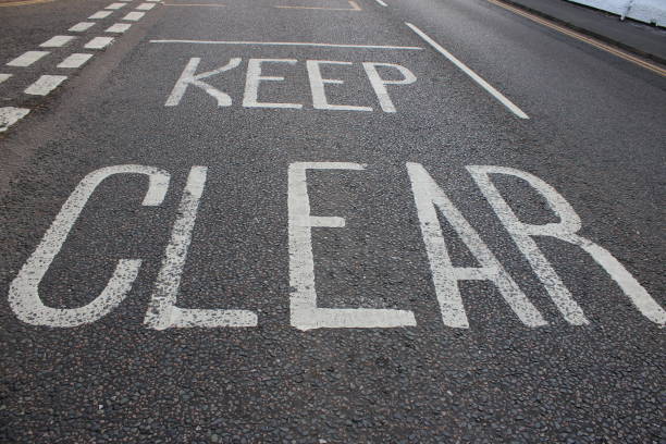 istock White road markings on main village street 