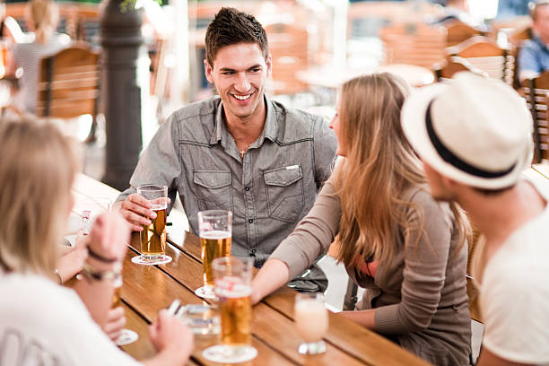 istock Young people drinking beer outdoors 173223737