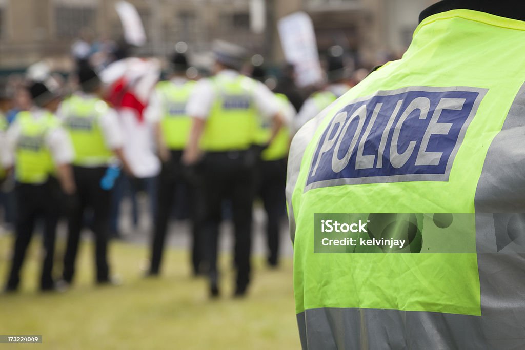 Police at a protest rally British Police in high visibility jackets at a protest rally. Police Force Stock Photo