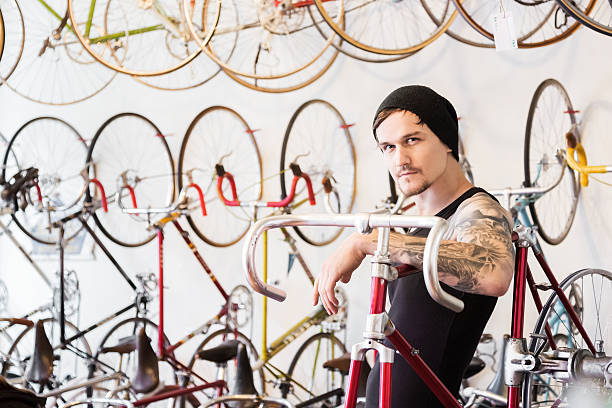 Young mechanic in a bike store in Berlin, Germany