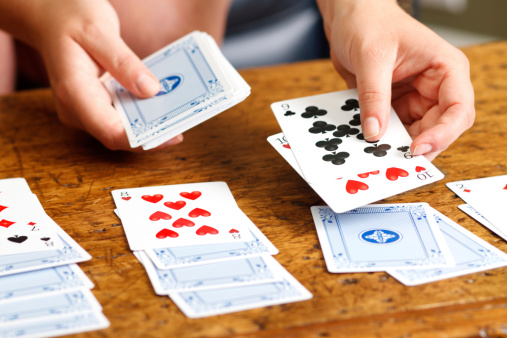 Hands Playing Solitaire Card Game