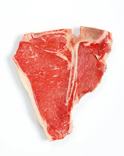 Photo of Raw T-Bone Steak Isolated On White