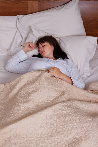 istock Young Woman Sleeping In Bed From Above 173228330