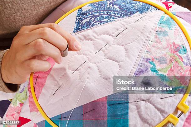 Womans Hand Stitching A Patchwork Quilt Stock Photo - Download Image Now - Quilt, Patchwork, Sewing