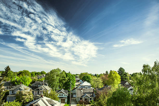 Green Portland Homes Portland Oregon's east-side "suburbs" on a warm summer day, a vibrant blue sky and clouds over neighborhood houses and green trees.  Horizontal with copy space. portland oregon photos stock pictures, royalty-free photos & images