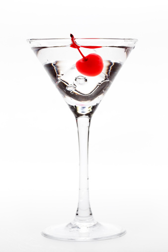 Martini splash with ice cubes