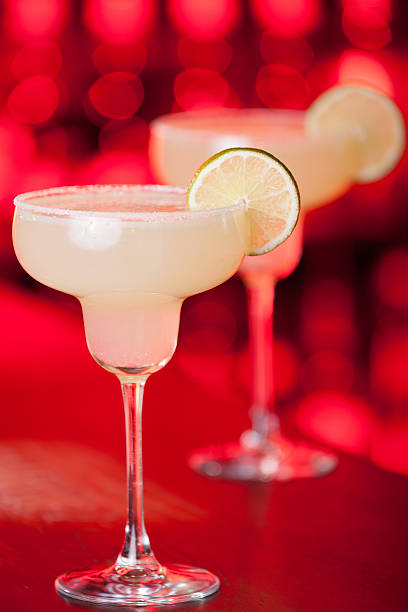 The margarita is a cocktail consisting of tequila mixed with orange-flavoured liqueur and lime or lemon juice, often served with salt on the glass rim.The drink is served shaken with ice, on the rocks, blended with ice (frozen margarita) or without ice (straight up).