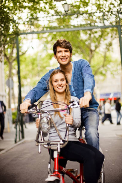 istock Man giving woman a lift on bicycle 173230974