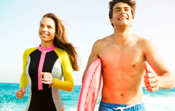 istock Young Surfer Couple on the beach 173231015