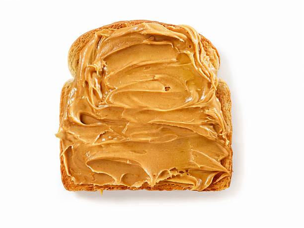 Peanut Butter on Toast Peanut Butter on Toast with Natural Drop Shadow- Photographed on Hasselblad H3D2-39mb Camera peanut butter stock pictures, royalty-free photos & images