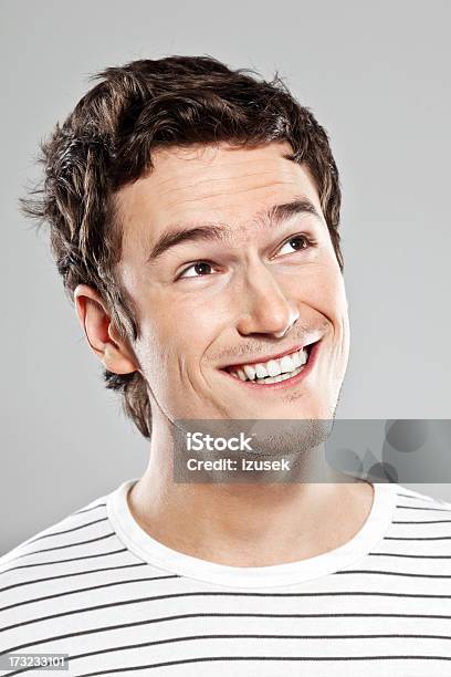 Happy Young Man Stock Photo - Download Image Now - Men, Laughing, Looking Away