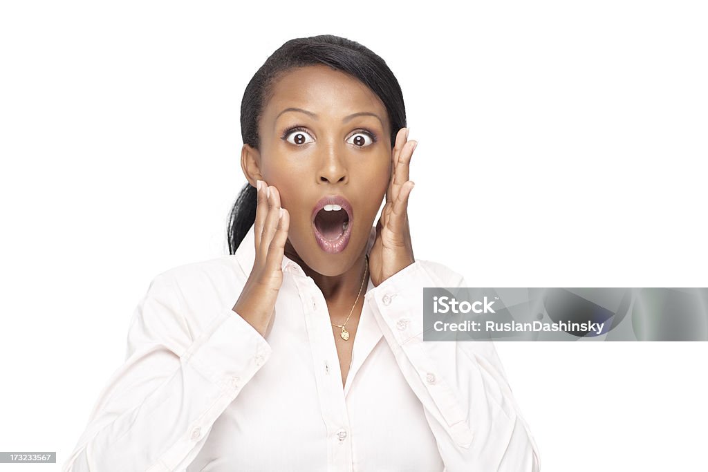 Terrified young woman customer. Shocked young African woman with hands on cheeks, open mouth and eyes. Studio shot isolated on white. Fear Stock Photo