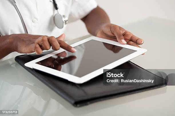 Doctor Using Tablet Computer Stock Photo - Download Image Now - Computer Monitor, Laptop, Desk