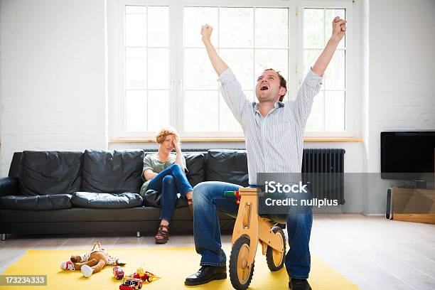 Rediscovering The Child Within Stock Photo - Download Image Now - Humor, Father, Bicycle