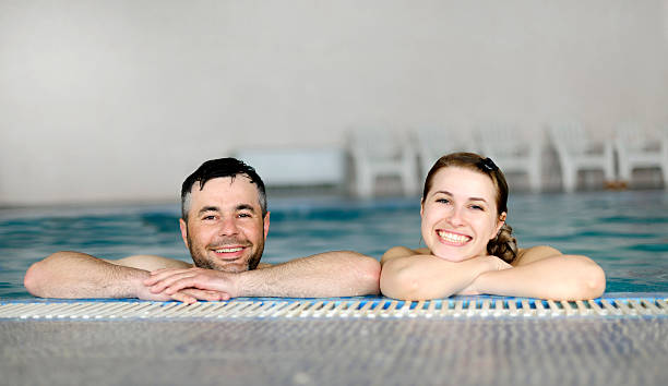 istock cheerful friends in pool 173234828