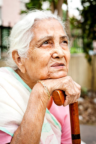 istock One sad pensive senior Indian woman looking up 173236743