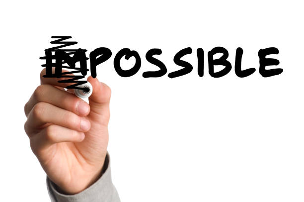 Marker scratching out the I and M in the word impossible businessman transforming the impossible to possible possible stock pictures, royalty-free photos & images