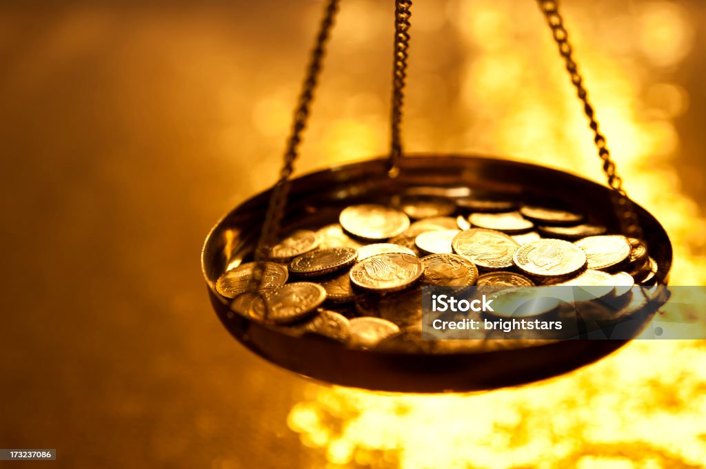 Gold coins on a weight scale http://www.gunaymutlu.com/iStock/GOLD_Banner.jpg Gold - Metal Stock Photo