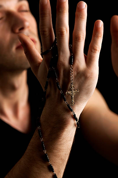istock close-up of young man praying 173237663