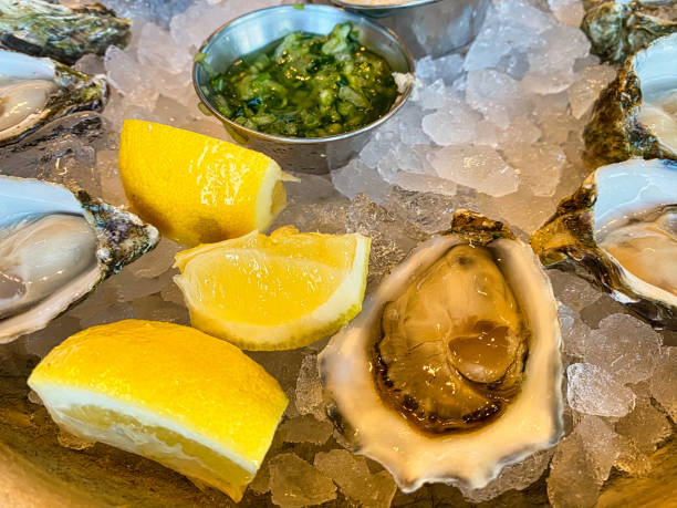 istock Fresh delicious oysters with lemon 1732379967