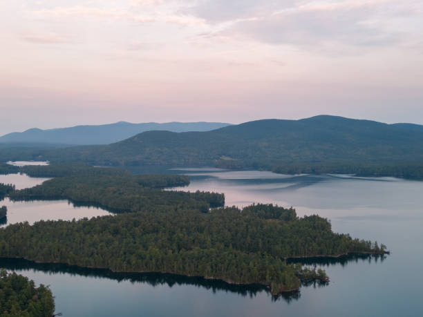 istock Drone aerial above cloud inversion on Squam Lake at sunrise 1732389189