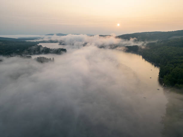 istock Drone aerial above cloud inversion on Squam Lake at sunrise 1732391231