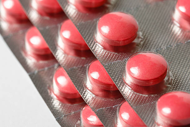 Close up of a blister of red pills
