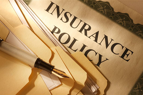 istock File folders and fountain pen resting on insurance policy 173239793