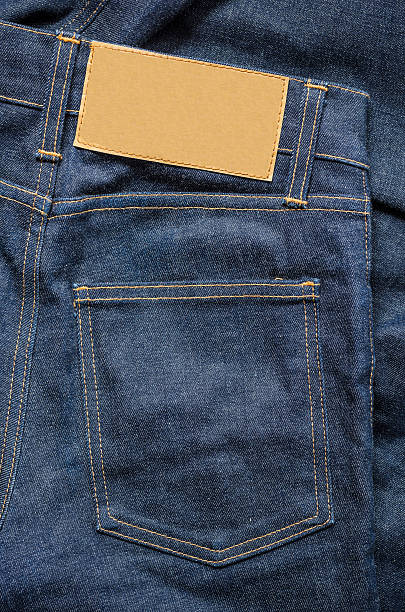 Blue Jeans with Blank leather label Highly detailed closeup of  Blue Jeans leather pocket clothing hide stock pictures, royalty-free photos & images