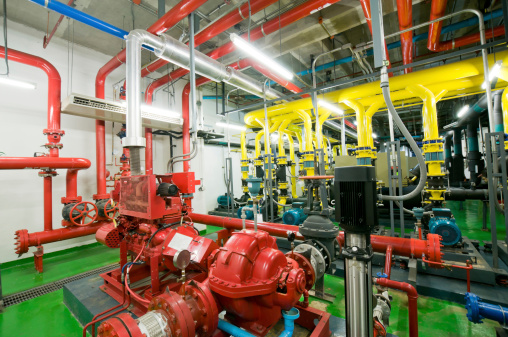 Water pumping station, industrial interior and pipes  .