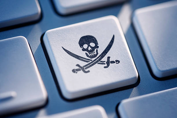 Pirate Key On Computer Keyboard Pirate button on computer keyboard. pirate criminal stock pictures, royalty-free photos & images