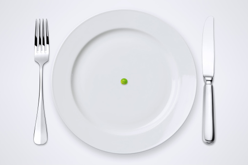 One Green Pea On Plate. Table Setting With Clipping Path.