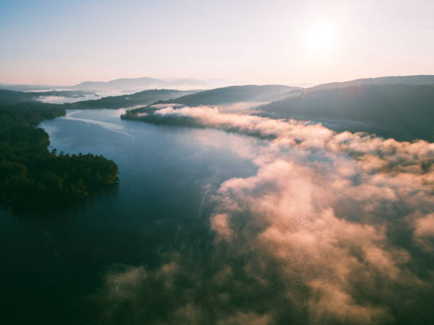 Sunrise aerial of cloud inversion on Little Squam Lake  at sunrise in fall