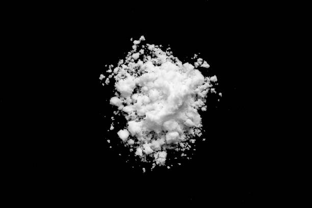 istock White snow isolated on black background close up 1732410164