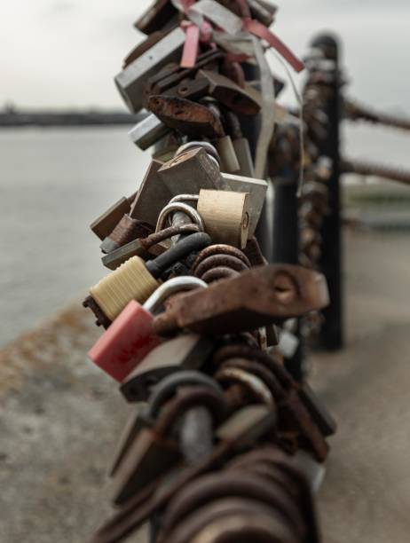 istock Many love padlocks locked on iron chain with perspective. 1732414860
