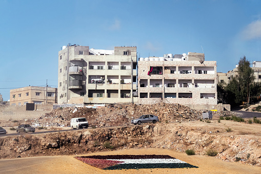 A view of the densely constructed homes at a hill in a typical Arab city in the Middle East.