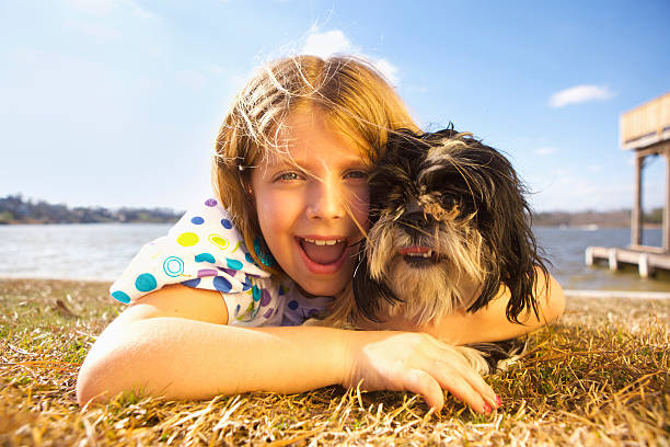 istock Girl Playing with Dog 173242707