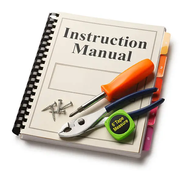 An instruction manual with tools on it. Clipping path included.