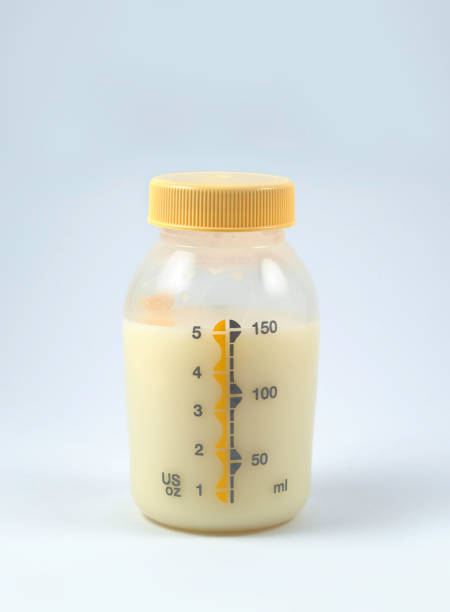 Bottle of Pumped Breast Milk Bottle of Pumped Breast Milk over white background breast milk stock pictures, royalty-free photos & images