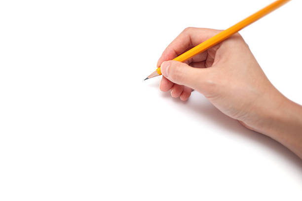Drawing A hand is holding a pencil ready to draw, isolated on white background. hand drawing stock pictures, royalty-free photos & images