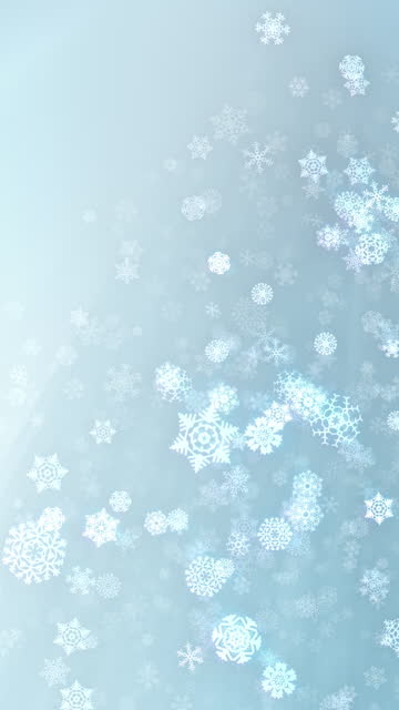 Christmas snowflakes falling loop with copy space, light pastel subtle background. Vertical Video.