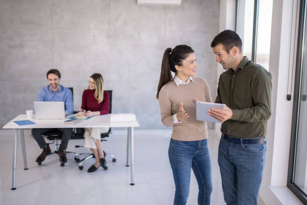 istock Happy business partners working in the office. 1732443032