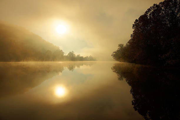istock Sun rising through a misty James River 173245275