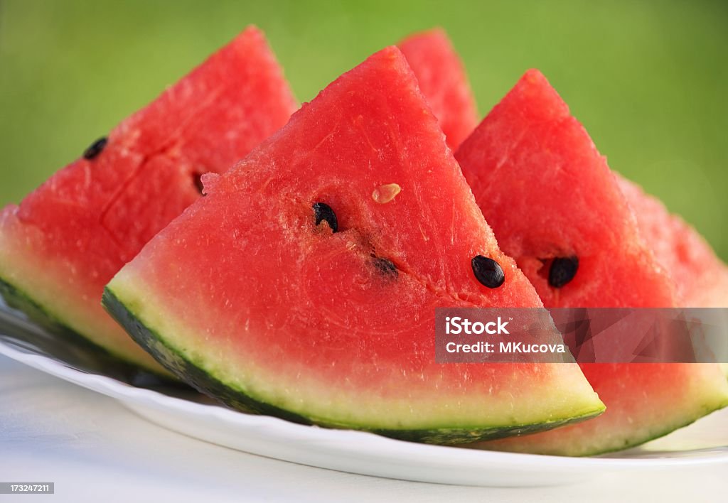 Portrait of watermelon slices on a white plate Slices of watermelon on plate. Selective focus. Food Stock Photo