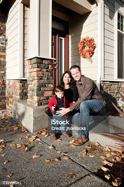 Young Family At Home Stock Photo - Download Image Now - Autumn, Family At Home, House