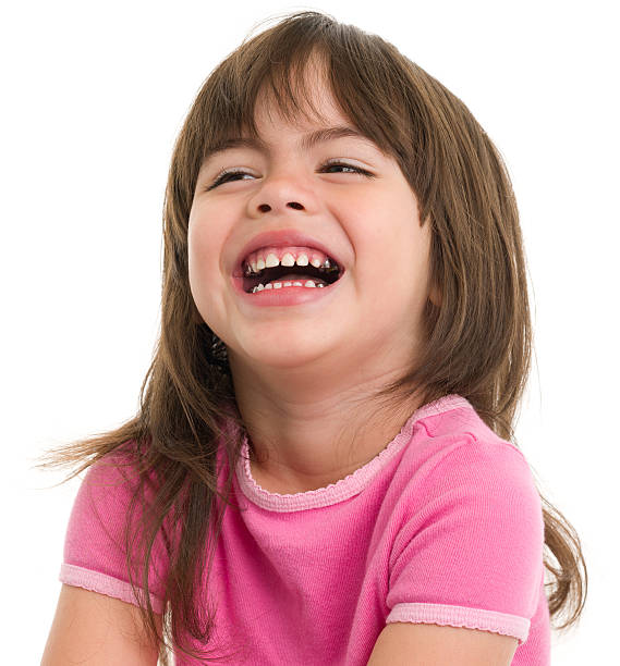 Laughing Little Girl Portrait of a little girl on a white background. http://s3.amazonaws.com/drbimages/m/np.jpg child laughing hysterically stock pictures, royalty-free photos & images